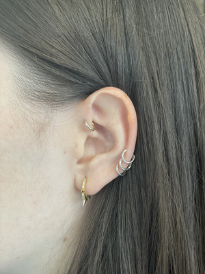 Piercing antihelix barbarroja tattoo